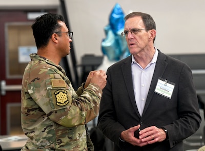 U.S. Air Force Lt. Col. Jonathan Rydberg and Scott Moore have a discussion during U.S. Indo-Pacific Command’s Capabilities Development Working Group at the Camp Withycombe Armed Forces Readiness Center in Happy Valley, Oregon on March 5, 2025.