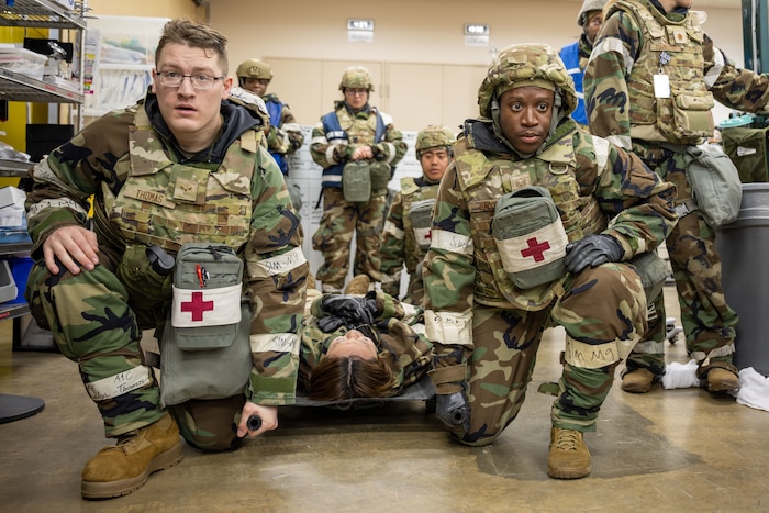 U.S. Air Force Airmen from the 35th Medical Group prepare to transport a simulated victim during a mass casualty exercise as part of Beverly Sunrise 25-03 at Misawa Air Base, Japan, March 17, 2025. Beverly Sunrise is a critical readiness exercise that enhances the 35th Fighter Wing’s ability to respond to real-world contingencies, ensuring medical personnel are prepared to provide life-saving care in austere conditions while reinforcing U.S. commitment to regional stability and a free and open Indo-Pacific. (U.S. Air Force photo by Senior Airman William Rodriguez)