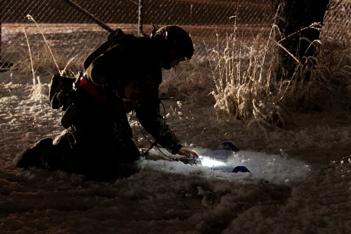 A U.S. Air Force Airman assigned to the 35th Civil Engineer Squadron explosive ordnance disposal flight rigs a simulated drone with detonation equipment during Beverly Sunrise 25-03 at Misawa Air Base, Japan, March 18, 2025. Continuous exercises like Beverly Sunrise sharpen operational effectiveness, reinforcing the 35th Fighter Wing’s combat superiority and readiness to respond to any threat. (U.S. Air Force photo by Senior Airman Brittany Russell)