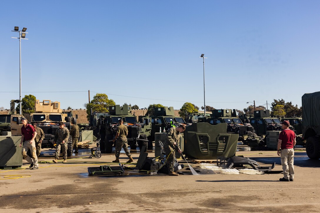 U.S. Marines with 2nd Battalion, 1st Marine Regiment, 1st Marine Division prepare for an inspection by the Australian Department of Agriculture, Fisheries and Forestry at Marine Corps Base Camp Pendleton, California, Jan. 14, 2025. This inspection is a bilateral biosecurity safety measure that ensures all gear is free of non-native plants, seeds, and insects that could potentially affect the Australian environment during the upcoming Marine Rotational Force - Darwin 25.3 deployment. (U.S. Marine Corps photo by Sgt. Ezekieljay Correa)