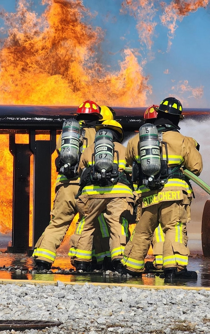 Firefighters from the Florida Air National Guard and the West Virginia Air National Guard trained on an aircraft fire simulator at Gulfport Combat Readiness Training Center in Gulfport, Mississippi, Feb. 23, 2025, during combined emergency response training. The training focused on aircraft and structural firefighting, emergency response tactics and mobility readiness.