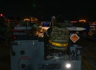 U.S. Air Force Airmen assigned to the 13th Fighter Generation Squadron prepare to load munitions during Beverly Sunrise 25-03 at Misawa Air Base, Japan, March 20, 2025. Airmen conduct high-tempo, real-world scenarios, from emergency response to sustainment operations, ensuring uninterrupted support and mission readiness under pressure. (U.S. Air Force photo by Senior Airman Brittany Russell)