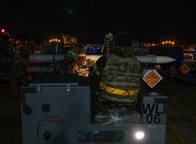 U.S. Air Force Airmen assigned to the 13th Fighter Generation Squadron prepare to load munitions during Beverly Sunrise 25-03 at Misawa Air Base, Japan, March 20, 2025. Airmen conduct high-tempo, real-world scenarios, from emergency response to sustainment operations, ensuring uninterrupted support and mission readiness under pressure. (U.S. Air Force photo by Senior Airman Brittany Russell)