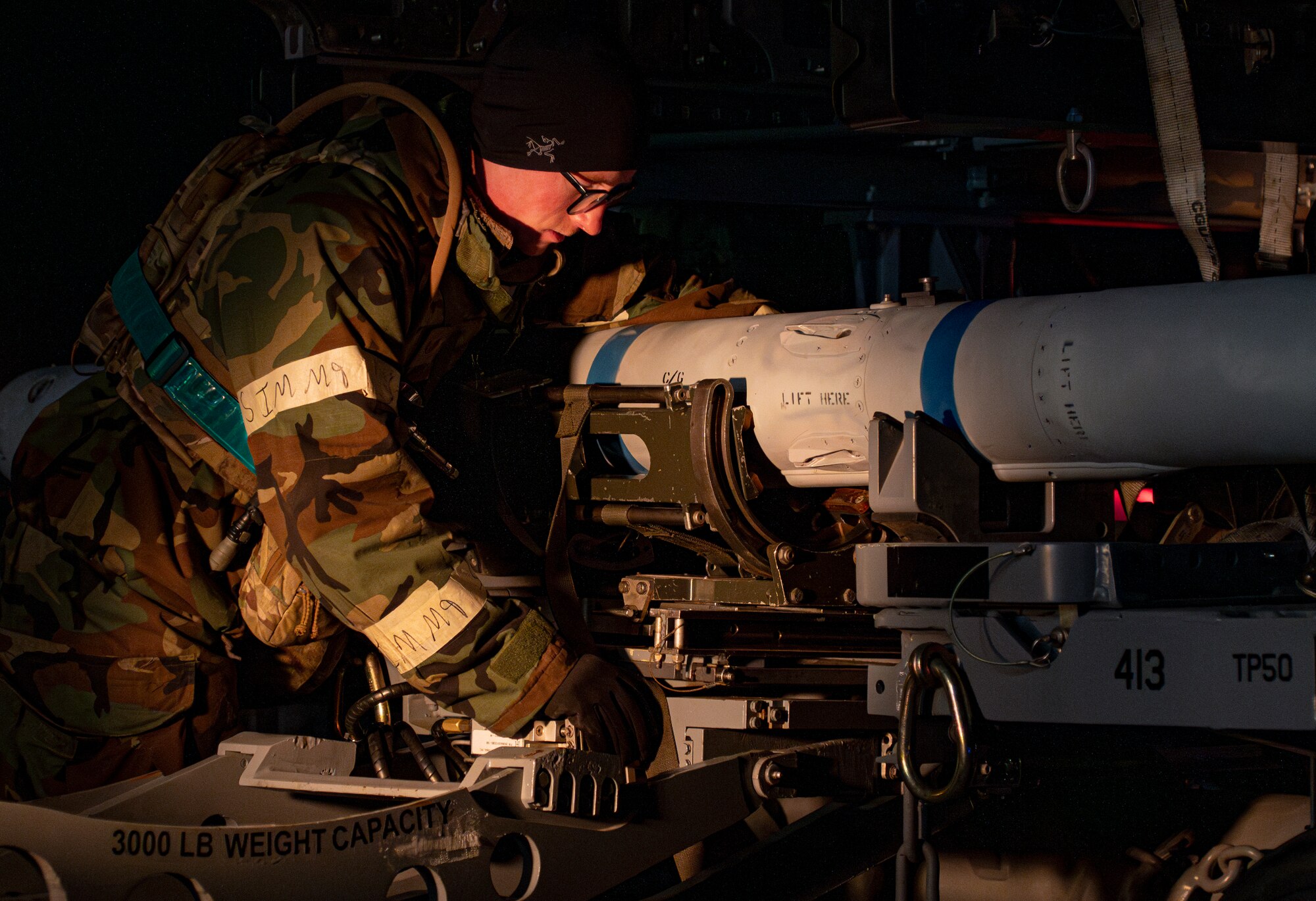 A U.S. Air Force Airman assigned to the 13th Fighter Generation Squadron prepares to load munitions during Beverly Sunrise 25-03 at Misawa Air Base, Japan, March 20, 2025. Airmen conduct high-tempo, real-world scenarios, from emergency response to sustainment operations, ensuring uninterrupted support and mission readiness under pressure. (U.S. Air Force photo by Senior Airman Brittany Russell)