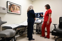 Suzanne Packard, a registered cardiac sonographer, points out an ultrasound of a heart to Amanda Engelke, a Licensed Vocational Nurse, at Wilford Hall’s 59th Medical Wing cardiology clinic March 13, 2025.