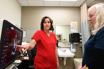 Suzanne Packard, a registered cardiac sonographer, points out an ultrasound of a heart to Amanda Engelke, a Licensed Vocational Nurse, at Wilford Hall’s 59th Medical Wing cardiology clinic March 13, 2025.