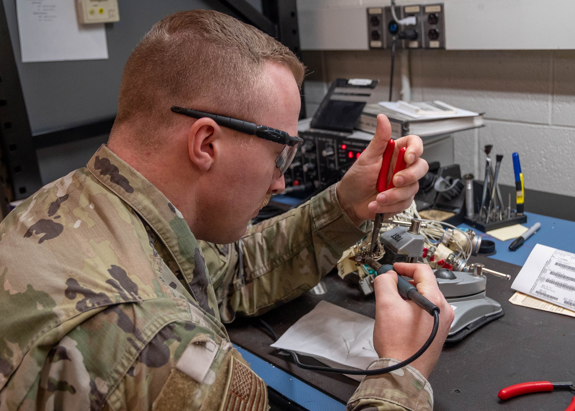 Maryland Air National Guard Staff Sgt. Derek Herbert, avionics test station and components technician for the 175th Maintenance Squadron, repairs a diode inside of an armament systems box at Warfield Air National Guard Base at Martin State Airport, Maryland, March 20, 2024.