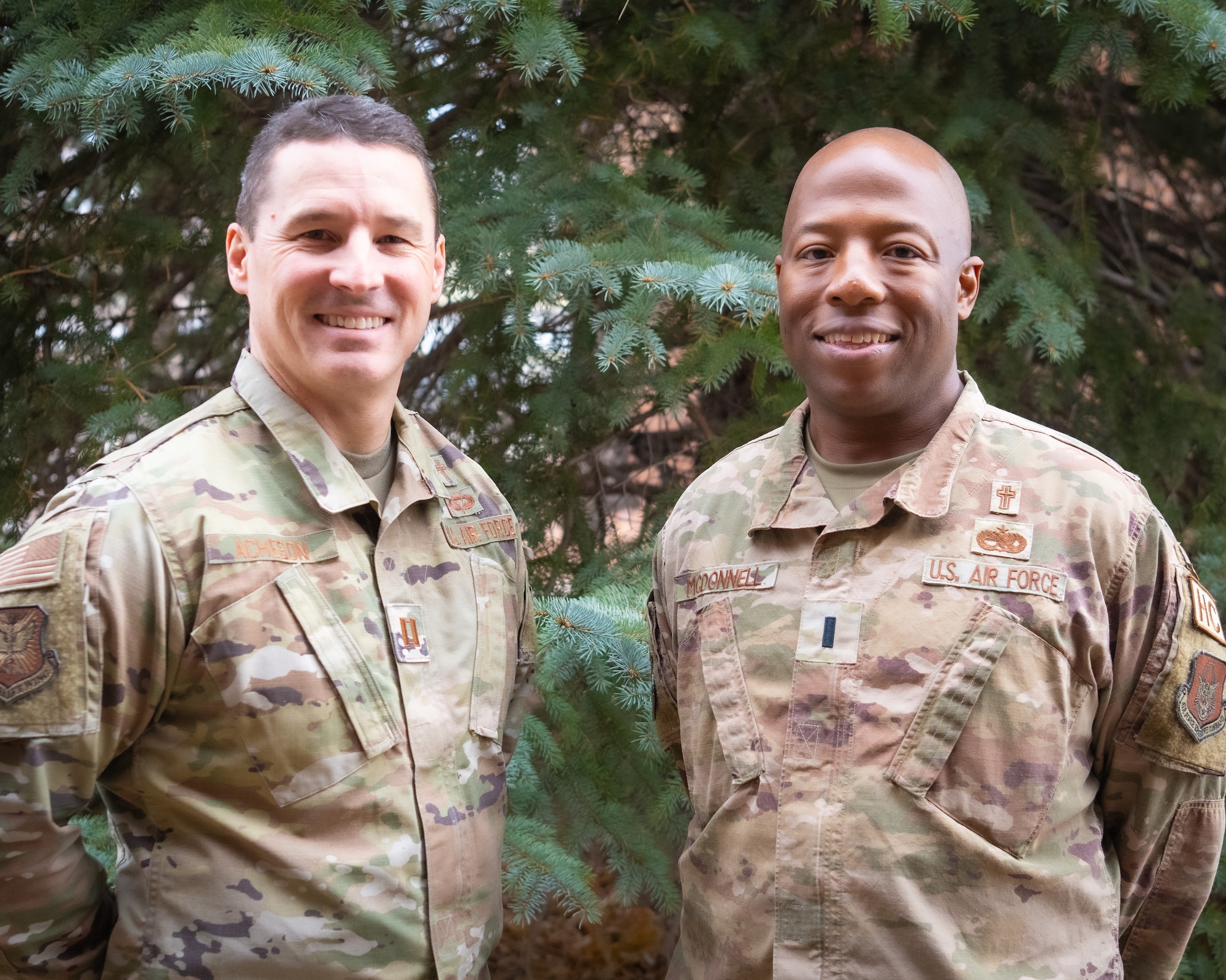 Two men in uniform posing for a photo.