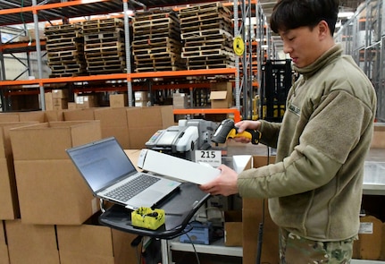 A member of the Korean Service Corps, a local national employee assigned to the U.S. Army Medical Materiel Center-Korea, checks incoming medical materiel during Freedom Shield 2025 at Camp Carroll, Republic of Korea.