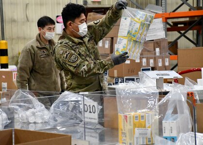 Members of the Korean Service Corps, local national employees working at the U.S. Army Medical Materiel Center-Korea, prepare a shipment of medical supplies during Freedom Shield 2025. USAMMC-K demonstrated its capability as the theater lead agent for medical materiel, or TLAMM, during the joint 11-day exercise in March.