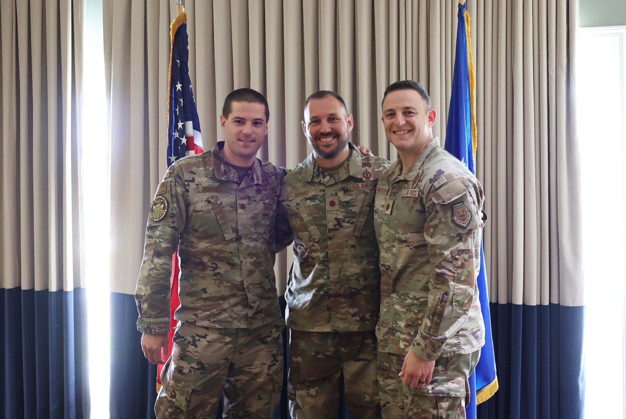 Military men in uniform at small graduation ceremony