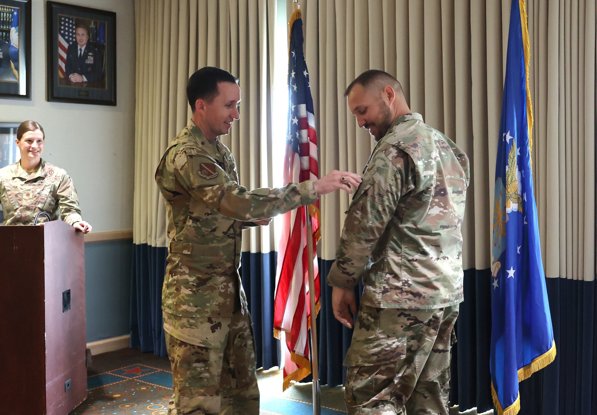 Military men in uniform at small graduation ceremony