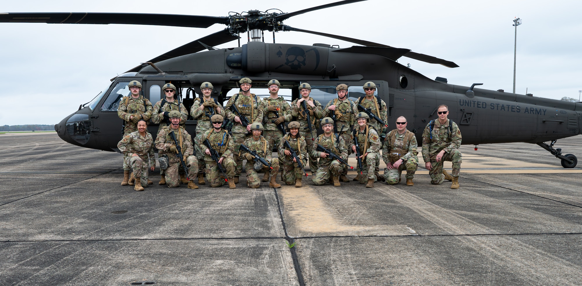 Crusader Challenge Class 25-1 poses for a group photo in front of a U.S. Army UH-60 Black Hawk helicopter at Maxwell Air Force Base, Alabama, March 19, 2025.