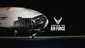 An aircraft sits on a flight line.