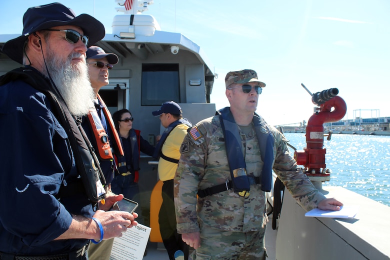 Paul Cotter, Jacksonville District Area Engineer, Construction Division, U.S. Army Corps of Engineers, explains a project to Col. Brandon Bowman, Commander, U.S. Army Corps of Engineers, Jacksonville District and Robert Musser, Senior Director of Environmental for Canaveral Port Authority during a tour onboard a boat at the Canaveral Port Authority March 20, 2025.
