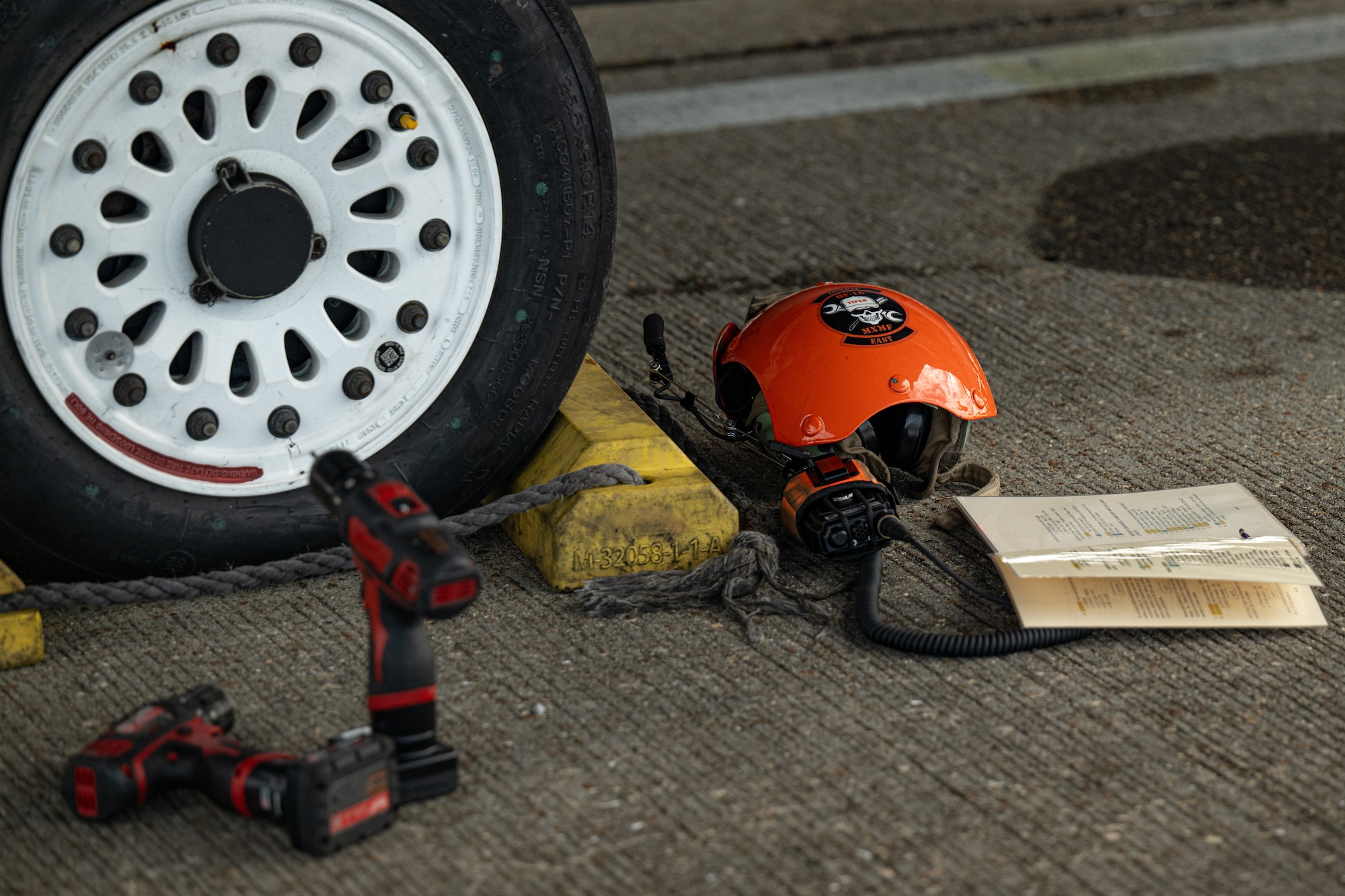 The gear of a contractor sits on the ground prior to preflight maintenance