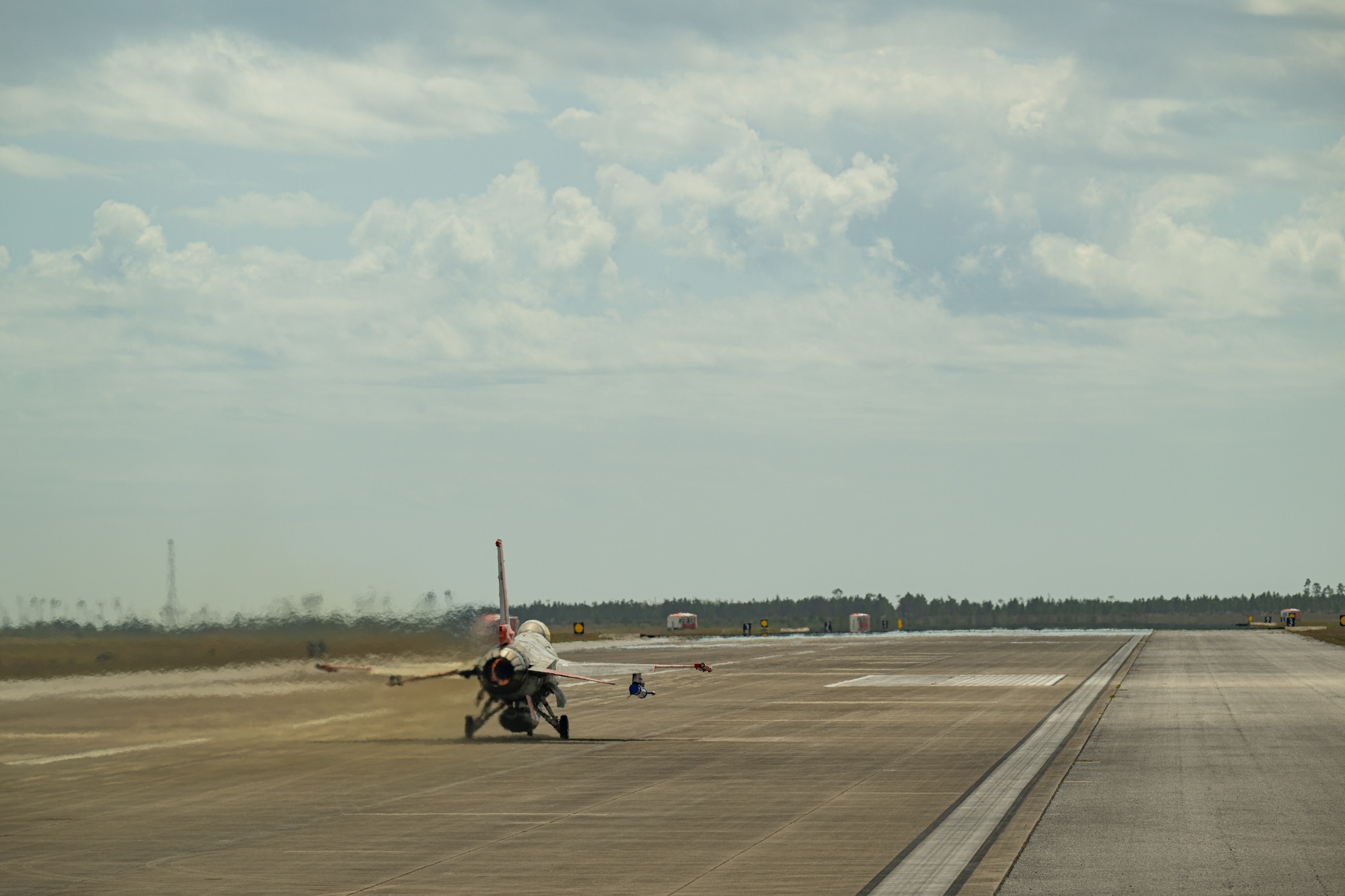 An aircraft takes off from the flight line