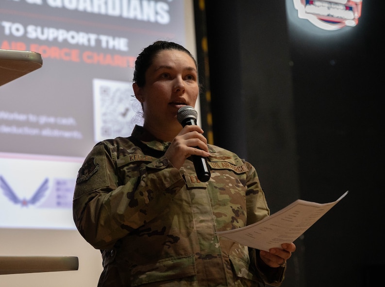 U.S. Air Force Captain Brianna Kelley,  69th Bomber Squadron weapon systems officer, delivers opening remarks at the 2025 Air Force Assistance Fund campaign kickoff at Minot Air Force Base, North Dakota, March 19, 2025. The Air Force Assistance Fund campaign is an annual event that raises money for charities supporting Airmen and their families when in need. (U.S. Air Force photo by Airman 1st Class Wesley Davies)