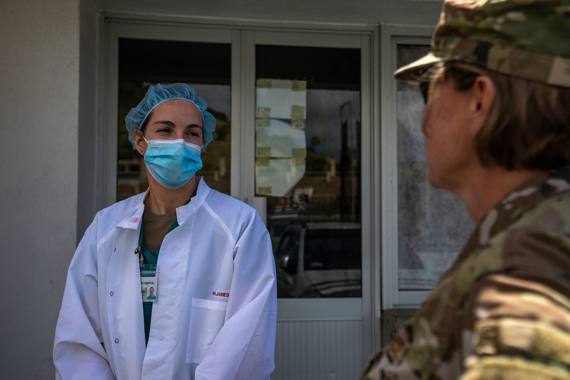 U.S. Air Force Brig. Gen. Tara Nolan, Mobilization Augmentee to the Air Forces Southern commander, talks to Capt. Samantha Parks, 349th Medical Squadron critical care nurse, during the Lesser Antilles Medical Assistance Team mission at St. Jude Hospital in Vieux Fort, Saint Lucia, March 6, 2025. Nolan visited the LAMAT operating locations in Saint Lucia and Saint Vincent and the Grenadines to observe operations firsthand and engage with both Airmen and host nation officials. (U.S Air Force photo by Andrea Jenkins)