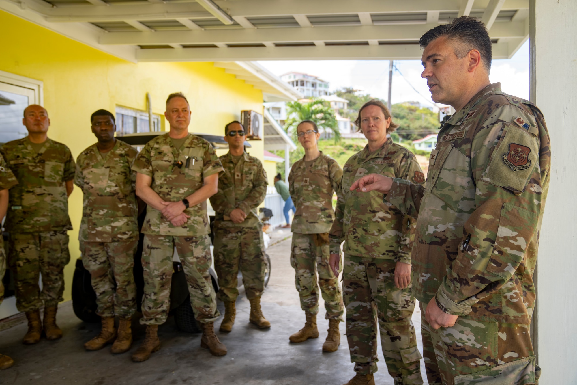 U.S. Air Force Col. Brian Gavitt, Air Forces Southern command surgeon, talks to Airmen during the Lesser Antilles Medical Assistance Team (LAMAT) 2025 mission at Canouan Island, Saint Vincent and the Grenadines, March 11, 2025. LAMAT 2025 is focused on strengthening medical readiness and global partnerships through healthcare engagements in the Lesser Antilles region and Guyana, embedding Air Force Reserve Command medical personnel with partner nation hospitals. (U.S Air Force photo by Andrea Jenkins)
