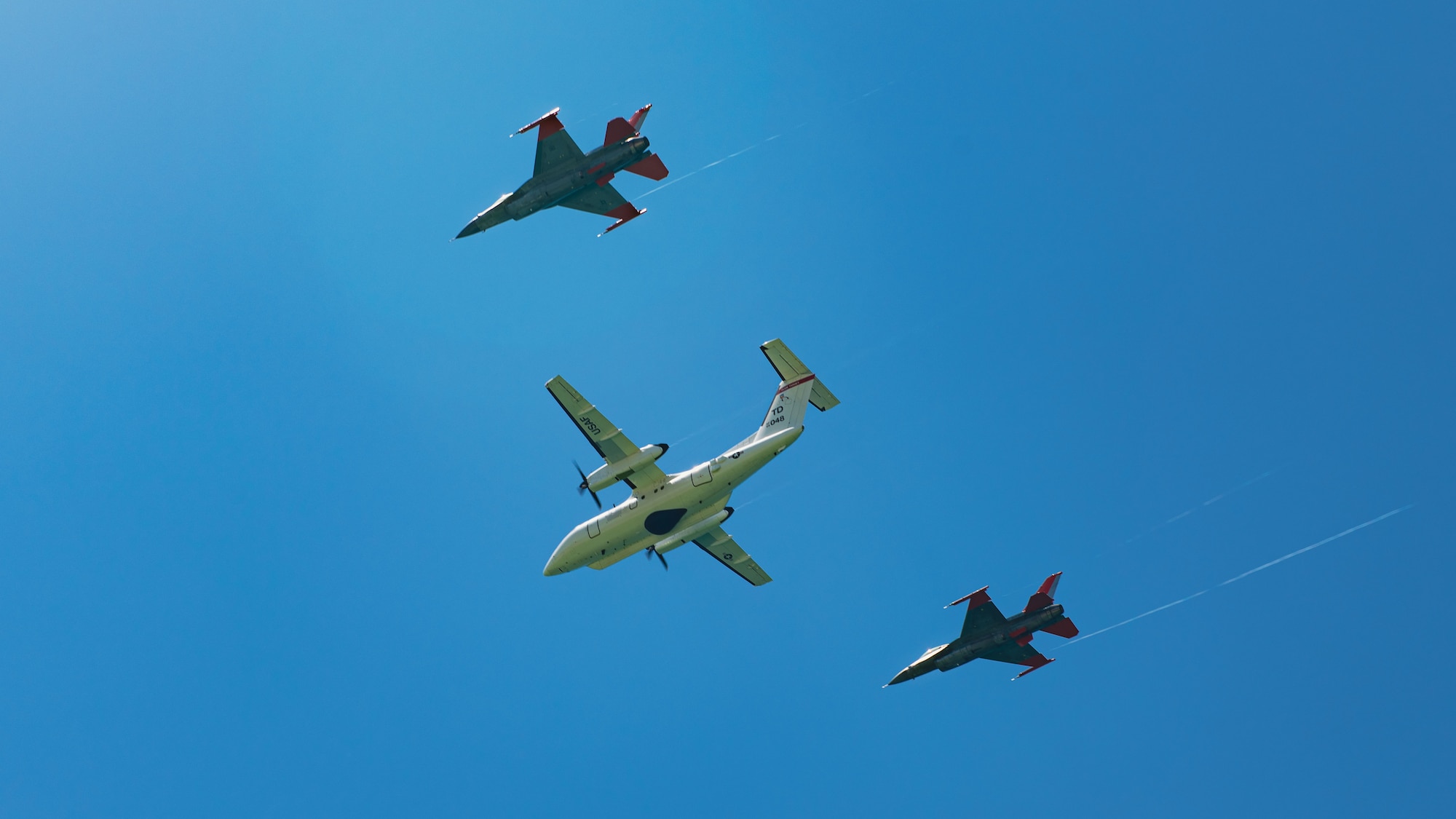 Three aircraft fly overhead