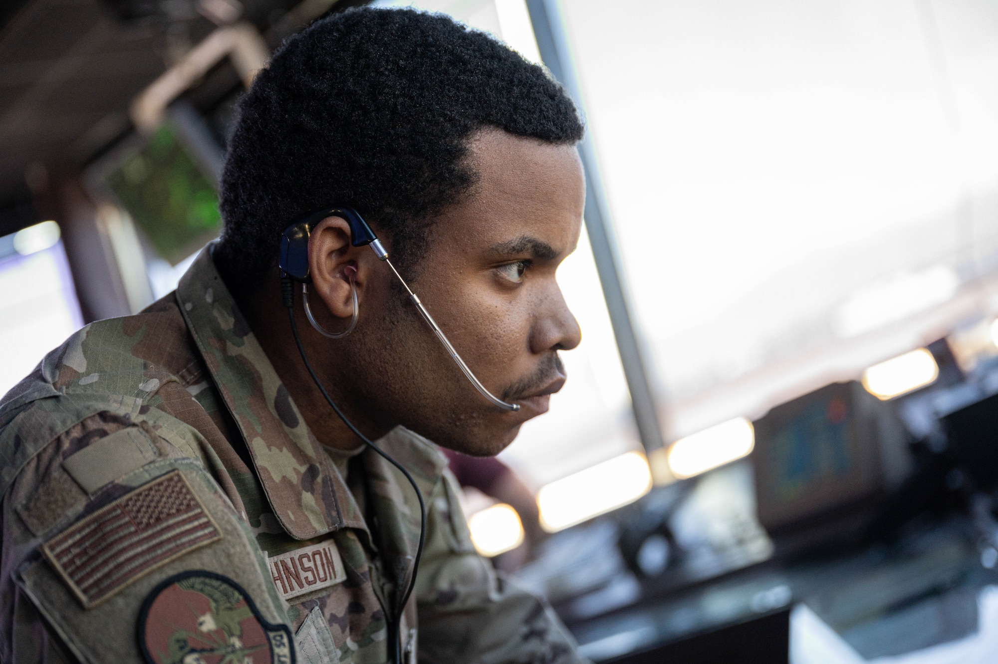 Airman 1st Class Kadarien Johnson, 56th Operations Support Squadron air traffic control apprentice, marks down the times of landings, Mar. 4, 2025, at Luke Air Force Base, Arizona.