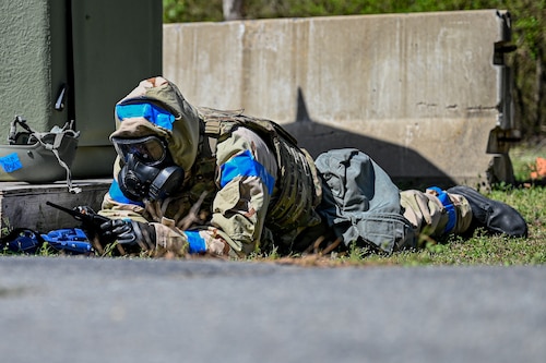 An Airman assigned to the 19th Civil Engineer Squadron talks on a handheld transceiver during a Prime Base Engineer Emergency Force (Prime BEEF) field training exercise at Little Rock Air Force Base, Arkansas, March 19, 2025. The exercise prepared Airmen to establish secure and functional bases even in hostile or resource-deprived environments.