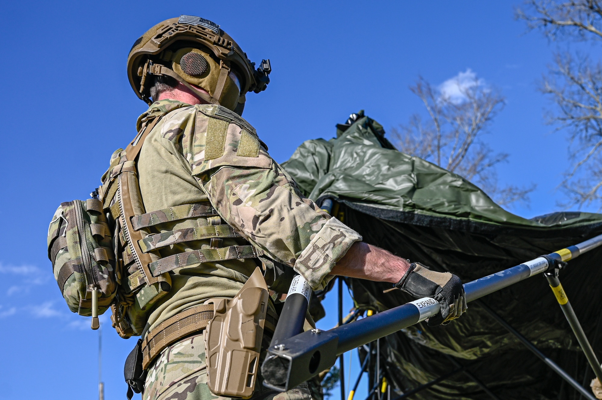 An Airman assigned to the 19th Civil Engineer Squadron assembles a Base-X tent during a Prime Base Engineer Emergency Force (Prime BEEF) field training exercise at Little Rock Air Force Base, Arkansas, March 19, 2025. Prime BEEF equipped Airmen with the technical skills needed to construct and maintain critical infrastructure in deployed locations.