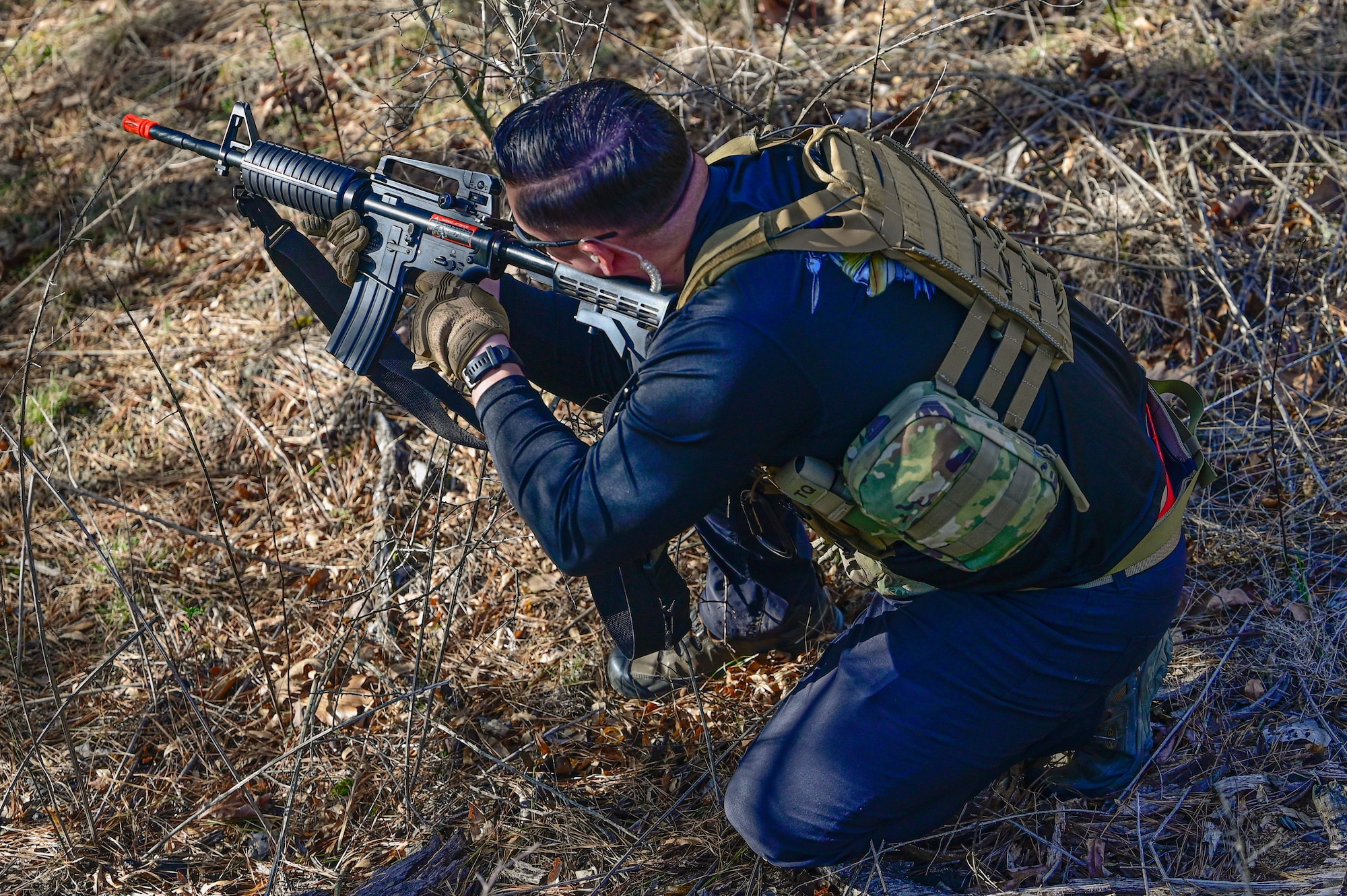 An Airman assigned to the 19th Civil Engineer Squadron engages in a simulated combat scenario during a Prime Base Engineer Emergency Force (Prime BEEF) field training exercise at Little Rock Air Force Base, Arkansas, March 19, 2025. The training developed leadership skills among both officers and enlisted personnel, ensuring a strong command structure in deployment situations.