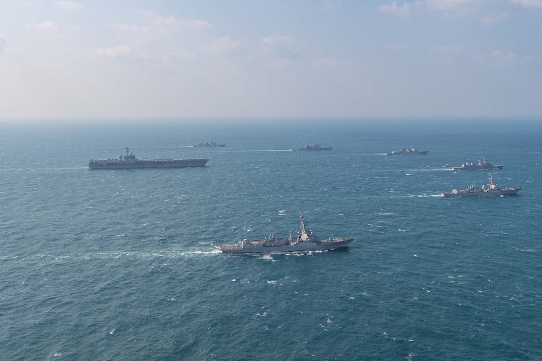 250318-N-GC571-1009 AT SEA (March 18, 2025) The Nimitz-class aircraft carrier USS Carl Vinson (CVN 70), left, sails in formation with the Ticonderoga-class guided-missile cruiser USS Princeton (CG 59), Arleigh Burke-class guided-missile destroyers USS Sterett (DDG 104) and USS Ralph Johnson (DDG 114), Sejong the Great-class destroyer ROKS Sejong the Great (DDG 991), Chungmugong Yi Sun-sin-class destroyer ROKS Dae Jo-yeong (DDH 977), and Murasame-class destroyer JS Ikazuchi (DD 107) at sea during a trilateral naval exercise, March 18, 2025. Trilateral exercises between the U.S. Navy, ROK Navy, and JMSDF continue to advance combined naval interoperability, ensure our militaries and self-defense forces can operate together against any threat, and demonstrate combined commitment to a secure and prosperous Indo-Pacific. (U.S. Navy photo by Mass Communication Specialist Seaman Apprentice Pablo Chavez)