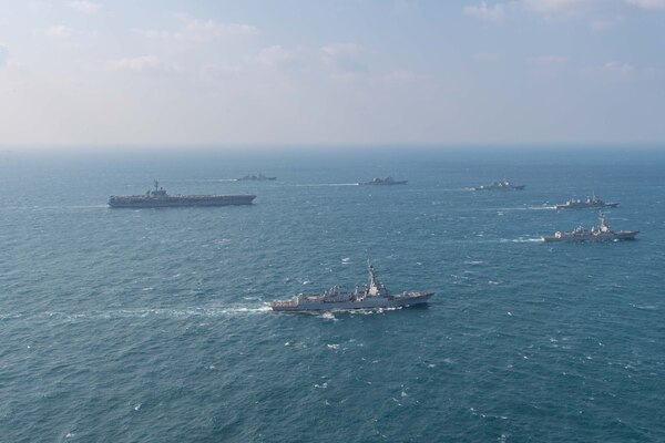 250318-N-GC571-1009 AT SEA (March 18, 2025) The Nimitz-class aircraft carrier USS Carl Vinson (CVN 70), left, sails in formation with the Ticonderoga-class guided-missile cruiser USS Princeton (CG 59), Arleigh Burke-class guided-missile destroyers USS Sterett (DDG 104) and USS Ralph Johnson (DDG 114), Sejong the Great-class destroyer ROKS Sejong the Great (DDG 991), Chungmugong Yi Sun-sin-class destroyer ROKS Dae Jo-yeong (DDH 977), and Murasame-class destroyer JS Ikazuchi (DD 107) at sea during a trilateral naval exercise, March 18, 2025. Trilateral exercises between the U.S. Navy, ROK Navy, and JMSDF continue to advance combined naval interoperability, ensure our militaries and self-defense forces can operate together against any threat, and demonstrate combined commitment to a secure and prosperous Indo-Pacific. (U.S. Navy photo by Mass Communication Specialist Seaman Apprentice Pablo Chavez)