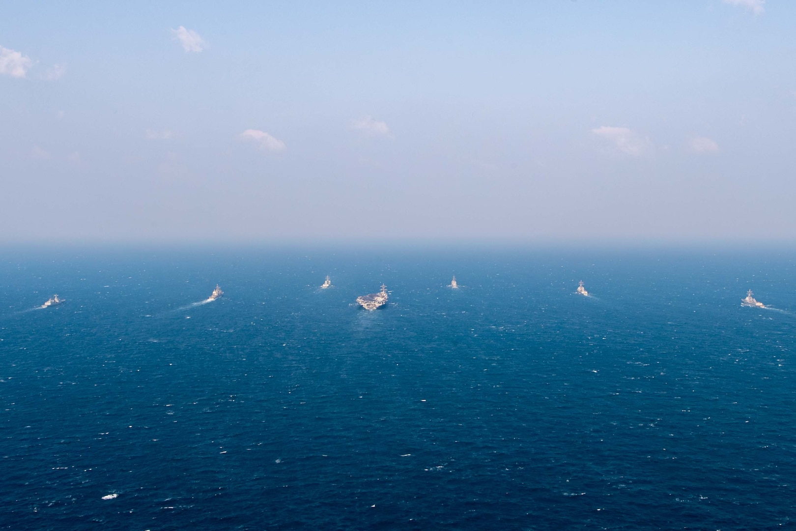 250318-N-GC571-1033 AT SEA (March 18, 2025) The Nimitz-class aircraft carrier USS Carl Vinson (CVN 70), center, sails in formation with the Ticonderoga-class guided-missile cruiser USS Princeton (CG 59), Arleigh Burke-class guided-missile destroyers USS Sterett (DDG 104) and USS Ralph Johnson (DDG 114), Sejong the Great-class destroyer ROKS Sejong the Great (DDG 991), Chungmugong Yi Sun-sin-class destroyer ROKS Dae Jo-yeong (DDH 977), and Murasame-class destroyer JS Ikazuchi (DD 107) at sea during a trilateral naval exercise, March 18, 2025. Trilateral exercises between the U.S. Navy, ROK Navy, and JMSDF continue to advance combined naval interoperability, ensure our militaries and self-defense forces can operate together against any threat, and demonstrate combined commitment to a secure and prosperous Indo-Pacific. (U.S. Navy photo by Mass Communication Specialist Seaman Apprentice Pablo Chavez)