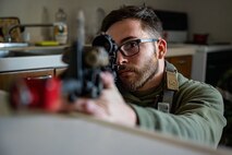 Airman aims a M4