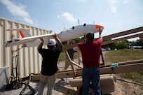 U.S. government contractors with the U.S. Army's Threat Systems Management Office and U.S. civilian contractors with Griffon Aerospace, prepare an Outlaw G2 MQM 170C target drone to launch for a simulated maritime strike at the Hat Yao Training Camp during exercise Cobra Gold, March 4.