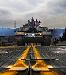 YEONCHEON-GUN, GYEONGGIDO [KYONGGI-DO], South Korea (March 20, 2025) — A Republic of Korea, 1st Capital Mechanized Infantry Brigade, K1 tank crosses a U.S. Army Improved Ribbon Bridge (IRB) during joint wet gap training as part of Freedom Shield 25 at Yeoncheon-gun, Republic of Korea, on March 20, 2025. Freedom Shield 25 is a multi-domain, military training exercise integrating ground, air, naval, space, and cyberspace elements to enhance readiness through realistic combat scenarios. (U.S. Army photo by Staff Sgt. Neil McLean.)