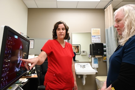 Suzanne Packard, a registered cardiac sonographer, points out an ultrasound of a heart to Amanda Engelke, a Licensed Vocational Nurse, at Wilford Hall’s 59th Medical Wing cardiology clinic March 13, 2025.