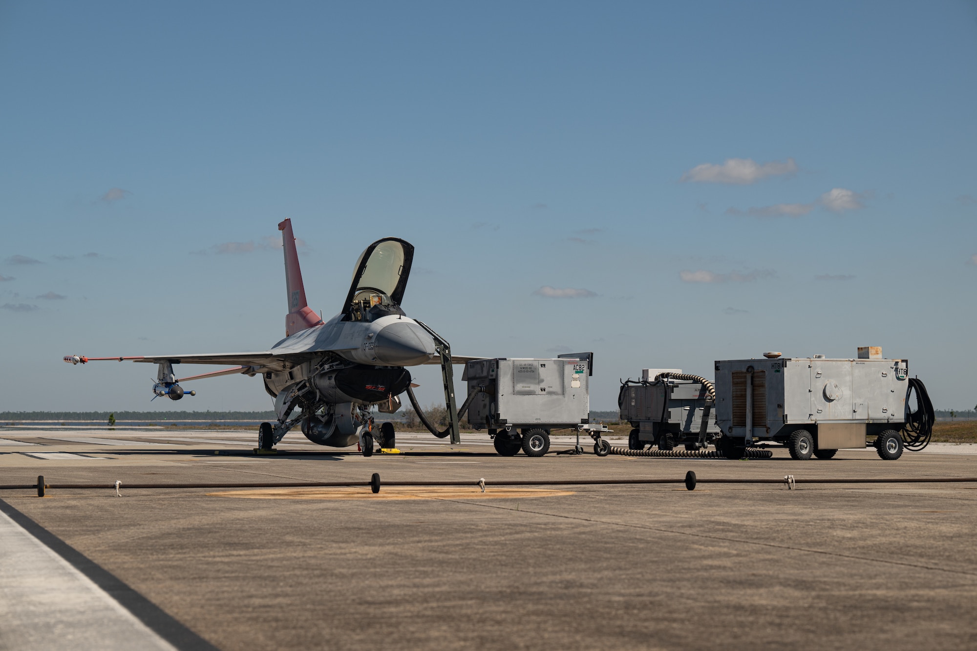 An aircraft sits on the flightline