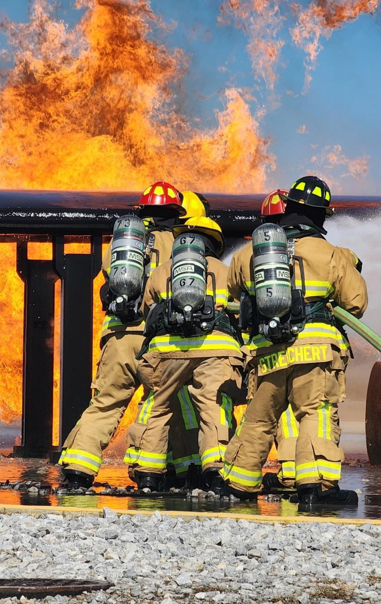 Firefighters from the Florida Air National Guard and the West Virginia Air National Guard trained on an aircraft fire simulator at Gulfport Combat Readiness Training Center in Gulfport, Mississippi, Feb. 23, 2025, during combined emergency response training. The training focused on aircraft and structural firefighting, emergency response tactics and mobility readiness.
