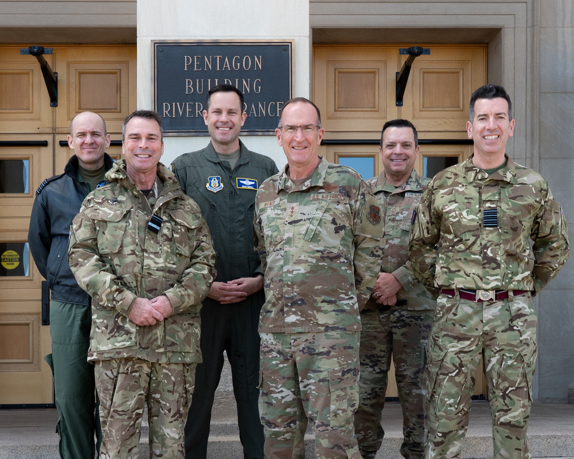 Military leaders stand as a group