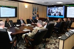 People in a conference room having virtual meeting