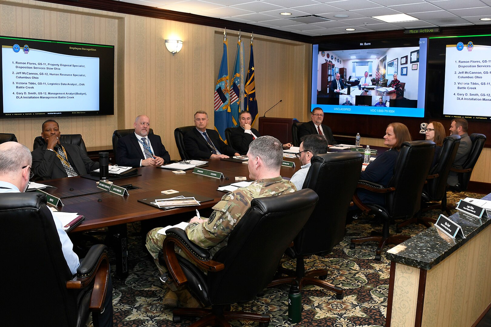People in a conference room having virtual meeting