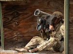 A Paratrooper assigned to the 82nd Airborne Division, aims a Advanced Anti-Tank Weapon System-Medium, FGM- 148 Javelin during the defense from tank lane during the Expert Soldier Badge lane.
