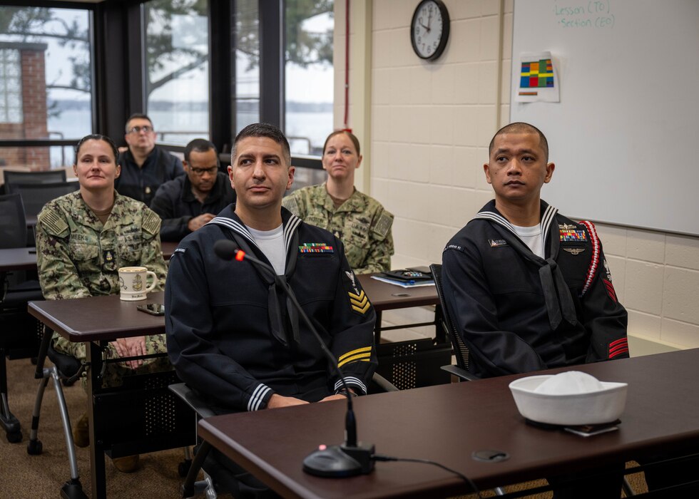 NEWPORT, R.I. – Musician 1st Class Gregory Lopes, left, assigned to Naval School of Music, and Logistics Specialist 1st Class Calvin Roldan, assigned to Naval Technical Training Center (NTTC) Meridian, standby while awaiting the results for the Center for Service Support’s (CSS) domain Sailors of the Year (SOY) announcement at Naval Station Newport, Rhode Island, Feb. 27, 2025. The SOY candidates are visiting from CSS subcommands to compete for domain SOY. Headquartered at Naval Station Newport, R.I., CSS’s mission is to develop and deliver naval administration, logistics, and media services training to achieve fleet readiness. (U.S. Navy photo by Brett Dodge)