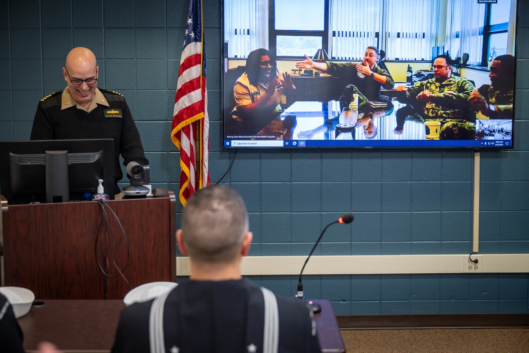 NEWPORT, R.I. – Culinary Specialist 1st Class Sakana Raqualla Gray, center left, assigned to Navy Service Support Advanced Training Command (NSSATC), reacts after Capt. Jose Hernandez, left, the Center for Service Support’s (CSS) commanding officer, announces her as the CSS domain Sailor of the Year (SOY) at Naval Station Newport, Rhode Island, Feb. 27, 2025. The SOY candidates are visiting from CSS subcommands to compete for domain SOY. Headquartered at Naval Station Newport, R.I., CSS’s mission is to develop and deliver naval administration, logistics, and media services training to achieve fleet readiness. (U.S. Navy photo by Brett Dodge)