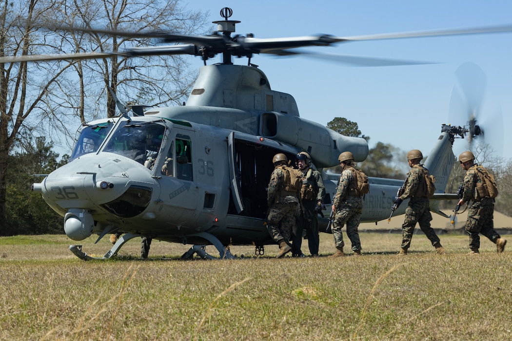 U.S. Marines with Marine Forces Reserve board a U.S. Marine Corps UH-1Y Venom utility helicopter during a field exercise on Camp Shelby Joint Forces Training Center, Mississippi, March 12, 2025. MARFORRES Marines conducted the exercise to maintain proficiency in warfighting, communication and leadership skills common to all Marines. (U.S. Marine Corps photo by Lance Cpl. Van Hoang)