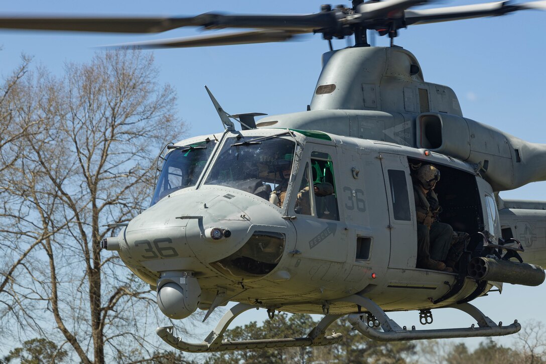 A U.S. Marine Corps UH-1Y Venom utility helicopter, with Marine Light Attack Helicopter Squadron (HMLA) 773, 4th Marine Aircraft Wing, Marine Forces Reserve, transports Marines during a field exercise on Camp Shelby Joint Forces Training Center, Mississippi, March 12, 2025.  MARFORRES Marines conducted the exercise to maintain proficiency in warfighting, communication and leadership skills common to all Marines. (U.S. Marine Corps photo by Lance Cpl. Van Hoang)