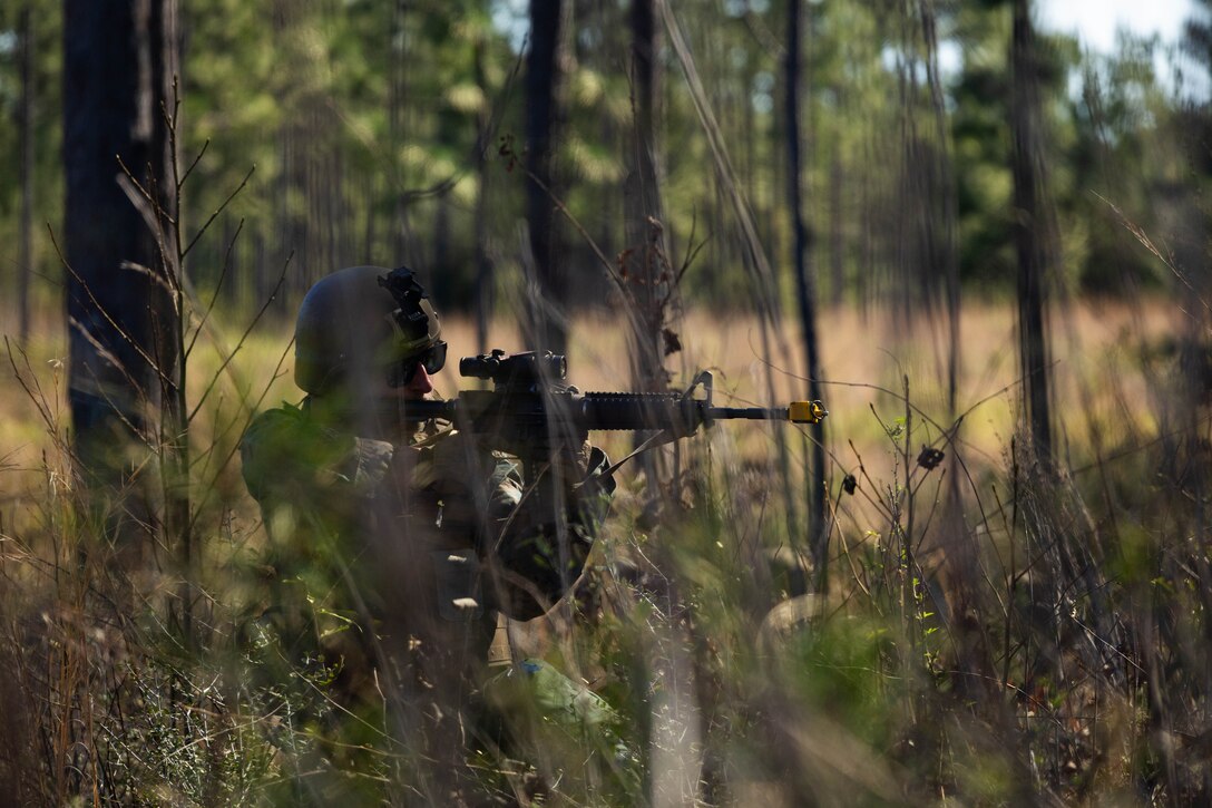 U.S. Marine Corps Cpl. Donovan Murphy, an administrative specialist with Marine Forces Reserve provides security on a patrol during a field exercise on Camp Shelby Joint Forces Training Center, Mississippi, March 10, 2025. MARFORRES Marines conducted the exercise to maintain proficiency in warfighting, communication and leadership skills common to all Marines. (U.S. Marine Corps photo by Lance Cpl. Van Hoang)