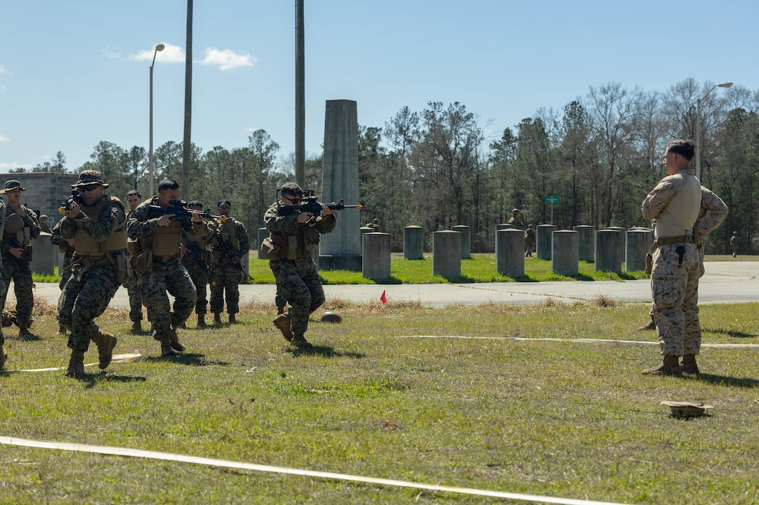 U.S. Marines with Marine Forces Reserve learn room-clearing techniques using a tape house on Camp Shelby Joint Forces Training Center, Mississippi, March 10, 2025. MARFORRES Marines conducted the exercise to maintain proficiency in warfighting, communication and leadership skills common to all Marines. (U.S. Marine Corps photo by Lance Cpl. Van Hoang)