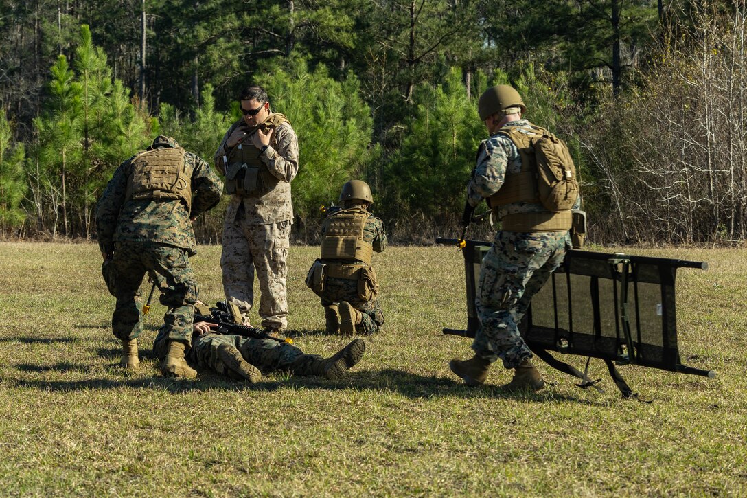 U.S. Marines with Marine Forces Reserve use a stretcher to transport a simulated casualty to a casualty collection point during a field exercise on Camp Shelby Joint Forces Training Center, Mississippi, March 10, 2025. MARFORRES Marines conducted the exercise to maintain proficiency in warfighting, communication and leadership skills common to all Marines. (U.S. Marine Corps photo by Lance Cpl. Van Hoang)