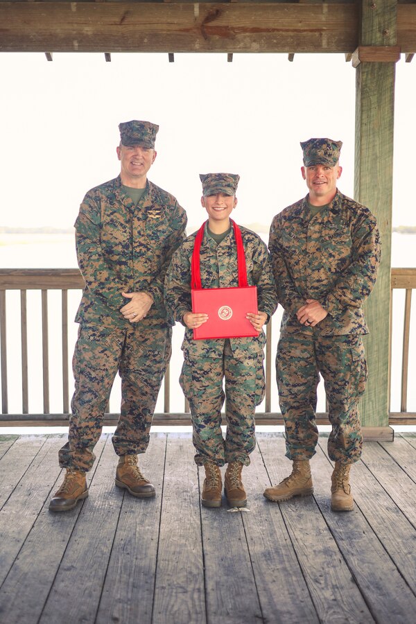 U.S. Marine Corps Cpl. Delilah Romayor, combat graphic specialist, Headquarters and Headquarters Squadron, Marine Corps Air Station Beaufort, poses for a photo after being promoted to the rank of Corporal at MCAS Beaufort, South Carolina, Nov. 18, 2024. A Corporal plays a vital leadership role, responsible for guiding, training, and mentoring junior enlisted Marines while ensuring the success of their assigned tasks and missions. (U.S. Marine Corps photo by Cpl. Mason Coots)